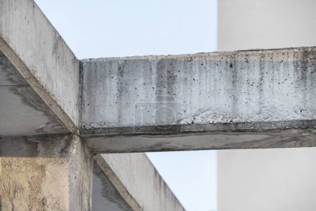 A crossbar of concrete beams and columns outdoors