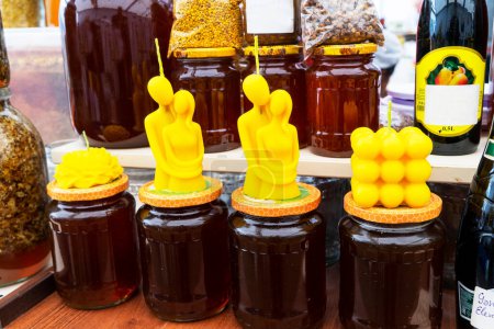 Natural sweet healthy honey in glass jars for sale on display . Healthy eating. Healthy lifestyle.