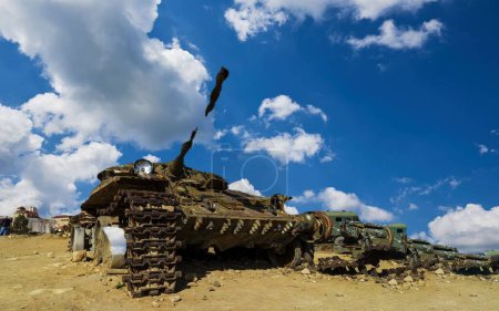 Photo for Damaged tanks, armored vehicles and equipment on the battlefield. military technics. Wide image for banners and advertisements - Royalty Free Image