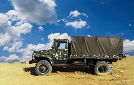 Photo for A damaged military truck on the battlefield. military technics - Royalty Free Image