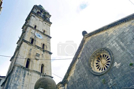 Bell tower and fragment of the main facade of the Church of St. Nicholas in Perast (Montenegro)