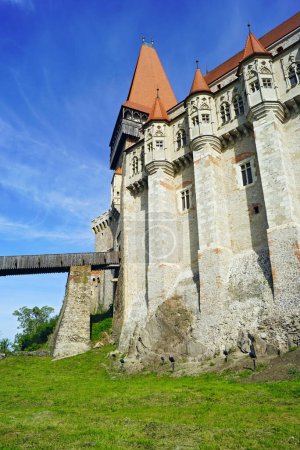 View of the facade of the Corvin Castle from the moat surrounding it (Hunedoara, Romania)