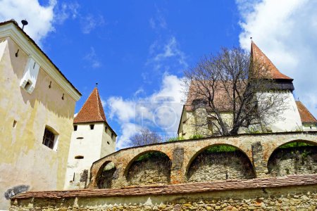 Architectural ensemble of the fortified church of Biertan in Romania: view of the towers and fortress walls