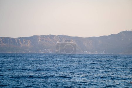 Photo for View of Kastellorizo Island from Kas district. Castellorizo, officially Megisti is a Greek island and municipality of the Dodecanese in the Eastern Mediterranean. - Royalty Free Image