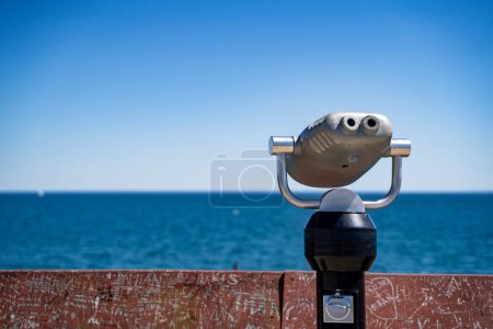 Coin operated tourist binoculars overlooking Lake Ontario.