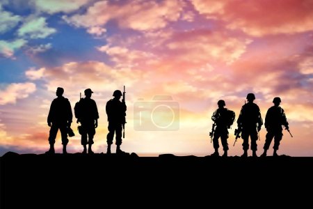 Illustration for Silhouetted Soldiers in Line on Ridge Against Gradient Orange - Royalty Free Image