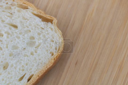 Photo for Sliced white bread on wooden board background. Copy space. - Royalty Free Image