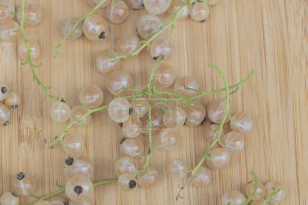 Photo for White currant on a wooden background. A bunch of white currant. - Royalty Free Image