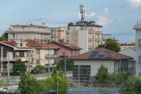 Photo for Rimini, Italy - August 5, 2023 Solar panels installed on the roof of a residential building in Rimini. - Royalty Free Image
