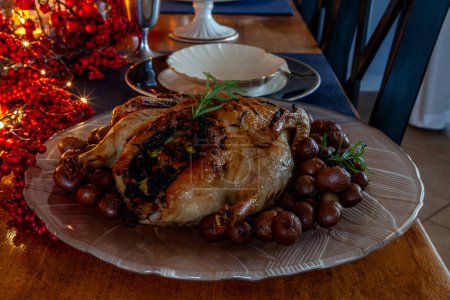 Roasted duck and stuffing on a holiday table with fine China.