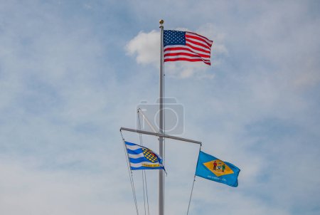 Photo for Three Flags on a Windy Day, Lewes Delaware USA, Lewes, Delaware - Royalty Free Image