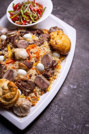 Mouthwatering image of Uzbek Plov dish with mutton, rice, carrots, onions, and spices on white plate. Rustic background adds authenticity.