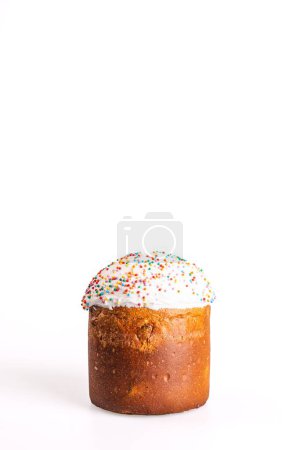 Kulich is a Russian Easter bread with sweet yeast dough, raisins, dried fruits, white icing, colorful sprinkles. Traditional festive treat.