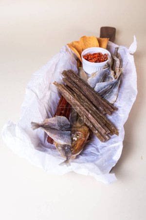 Top view of assorted dry fish for beer. fish on a wooden board.