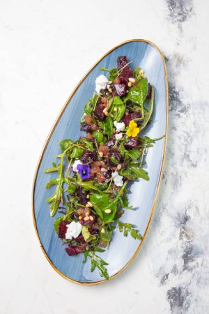 Wholesome and colorful salad of organic baby greens, roasted beets, creamy goat cheese, crunchy pistachios, and a light citrus dressing.