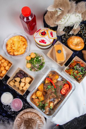 Indulge in the rich and vibrant flavors of Uzbek cuisine. This top view presentation captures the essence of Central Asian food culture.