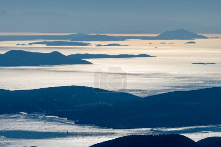 Photo for Aerial view of distant islands in morning light. - Royalty Free Image