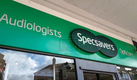 Photo for London. UK- 04.12.2023. The company name sign above the entrance of a branch of Specsavers. Opticians and audiologists. - Royalty Free Image