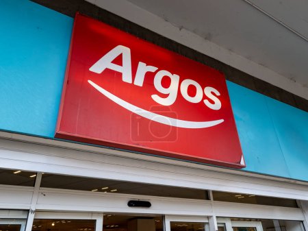 Photo for London. UK- 04.12.2023. The company name sign and logo of a branch of Argos. - Royalty Free Image