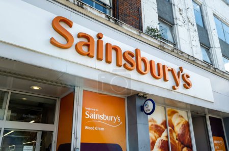 Photo for London. UK- 04.12.2023. The company name sign above the entrance of a branch of Sainsbury's grocery supermarket. - Royalty Free Image