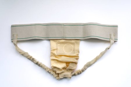 A jock strap isolated in white for post hernia surgery support of the groin and penis. Also as genital protective sports gear.