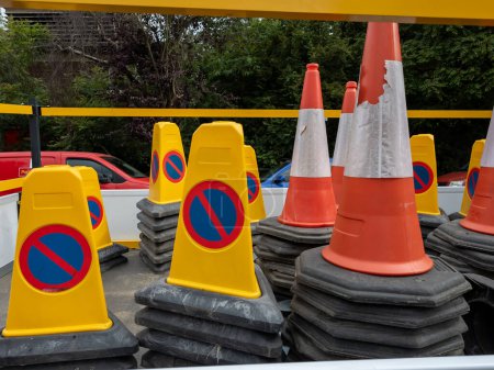 Road traffic cones use for controlling and restricting vehicles during highway maintenance and road work.