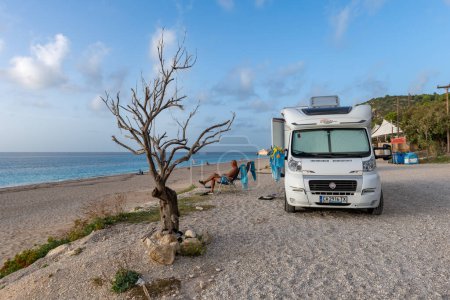 Photo for Lefkada island. Greece- 10.23.2023.Tourists camping with the camper vans and mobile homes on Kathisma Beach. - Royalty Free Image
