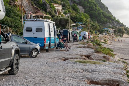 Photo for Lefkada island. Greece- 10.23.2023.Tourists camping with the camper vans and mobile homes on Kathisma Beach. - Royalty Free Image