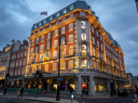 Photo for London. UK- 01.21.2024. A night time street view of the Fortnum and Mason luxury department store building in Piccadilly. - Royalty Free Image