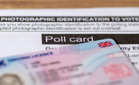 An official poll card for government elections and a UK photo driving licence as prove of identity.