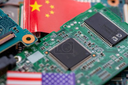 A technology political economic concept with the Chinese and American national flag a semi conductors circuit board.