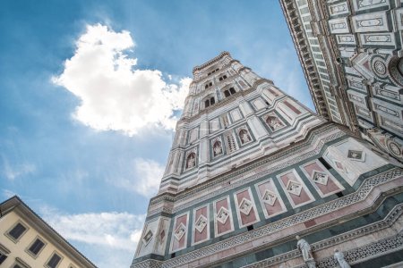 Photo for Giotto's Campanile, a bell tower which is a part of Florence Cathedral on the Piazza del Duomo in Florence, Italy. - Royalty Free Image
