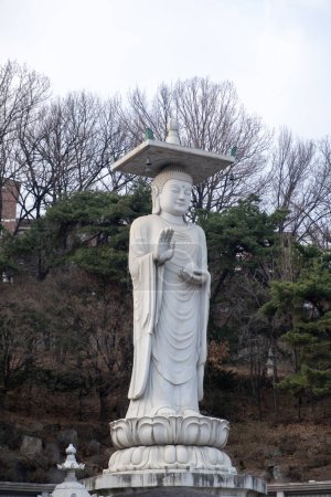 Mireuk Daebul statue of the bodhisattva Maitreya at Bongeunsa Temple, a Buddhist temple in Seoul. With background of winter to early spring. It is the tallest stone statue in Korea.