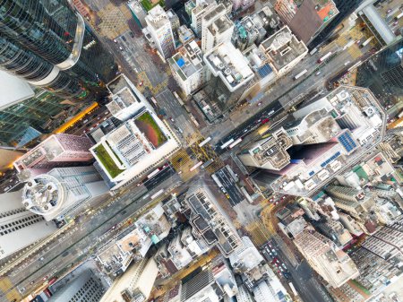 Photo for Cityscape skyscraper buildings, car traffic transport on road in Mong Kok town district, Hong Kong downtown. Drone aerial top view. Asian people lifestyle, Asia city life or public transportation - Royalty Free Image