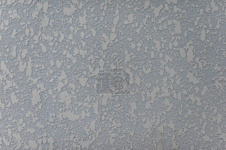 Textur einer grauen Stein dekorativen Putz oder Betonwand. Abstrakter Hintergrund für Design. Grauer Zierputz im Haus. Das Konzept des Bauens und Reparierens eines Hauses. Hintergrund.