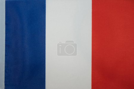 Einfache Flagge von Frankreich. Französisch einfache tricolor Stoff Textur Flagge. Blau, weiß und rot. Marianne. Hochwertiges Foto