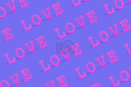 Téléchargez les photos : Creative pattern background with colorful Word LOVE. Love or Valentine's Day concept. Flat lay. Vivid pink and purple colors. - en image libre de droit