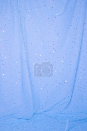 Foto de Aesthetic blue background with tulle and sequins. - Imagen libre de derechos