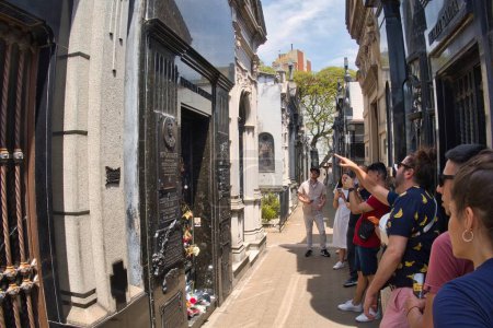 Photo for Buenos aires, argentina - 28 October 2022: people visiting and walking around the world famous landmark the La Recoleta cemetery with historic monumental graves with sculptures an architectural wonder - Royalty Free Image