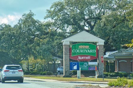 Photo for Charleston, united states - november 7 2022: the sign of courtyard by marriott hotel chain outside a long a road - Royalty Free Image
