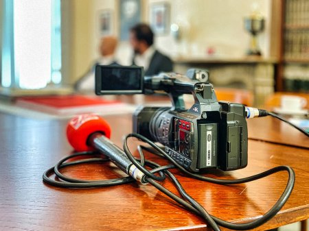 Photo for The hague, netherlands - the camera and microphone of a journalist is ready for an interview during a press meeting - Royalty Free Image