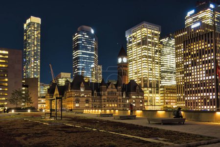 Photo for Toronto, Canada - 24 October 2022: view of skyscrapers at night with Toronto City Hall in front - Royalty Free Image