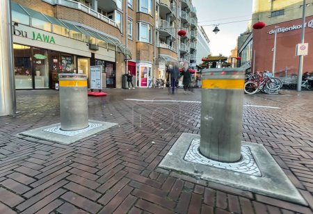 Photo for Den Haag, Netherlands - December 16 2021 : automatic bollards are used more and more on the street in dutch cities as security measure - Royalty Free Image