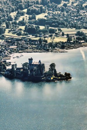 Talloires, France - September 08 2020 : an aerial view of the historic Castle and island of Saint Jorioz on his island