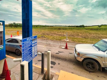 Photo for La paz, uruguay - October 30 2022: cars at a toll station and booth between Montevideo and colonia - Royalty Free Image
