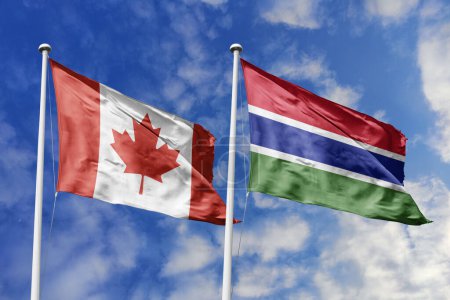 3D-Illustration. Kanada und Gambia schwenken Flaggen am Himmel. Hoch detaillierte Fahnenschwenken. 3D-Renderer. Winken im Himmel. Fahnen flatterten in den bewölkten Himmel.