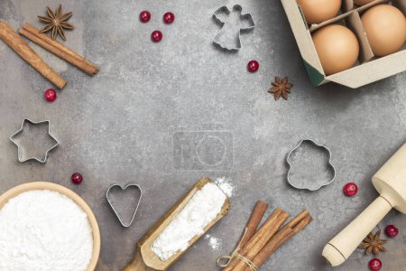 Photo for Ingredients for cooking Christmas baking on dark rustic baking tray.Christmas Baking background. Flat lay - Royalty Free Image