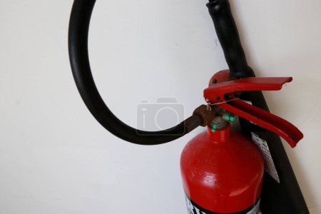 Foto de A fire extinguisher is an active fire protection device used to extinguish or control small fires, often in emergency situations. can also be called a small extinguisher for indoor - Imagen libre de derechos