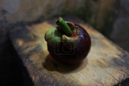 Photo of fresh purple mangosteen fruit, healthy and rich in vitamins