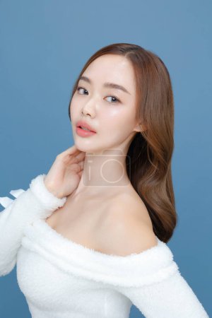 Photo for Young Asian beauty woman curly long hair with korean makeup style on face and perfect clean skin on isolated blue background. Facial treatment, Cosmetology, plastic surgery. - Royalty Free Image